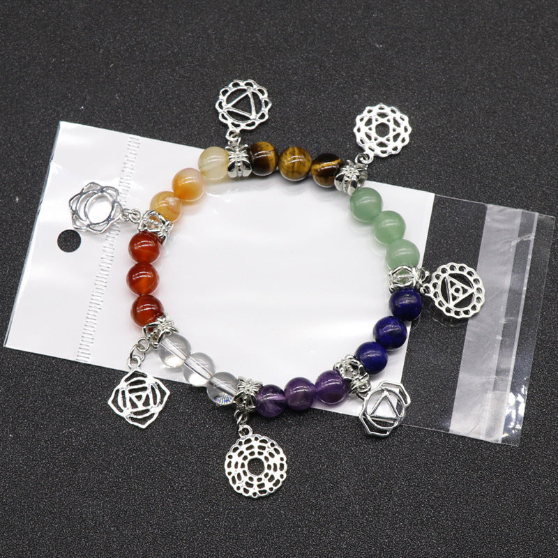 Natural Crystal 7 Chakra Bracelet. Designed to support balanced energy, inner peace, emotional healing, and spiritual growth, this chakra jewelry helps keep your mind, body, and spirit aligned. Created with love and positive energy — Divine Aura by Roop.