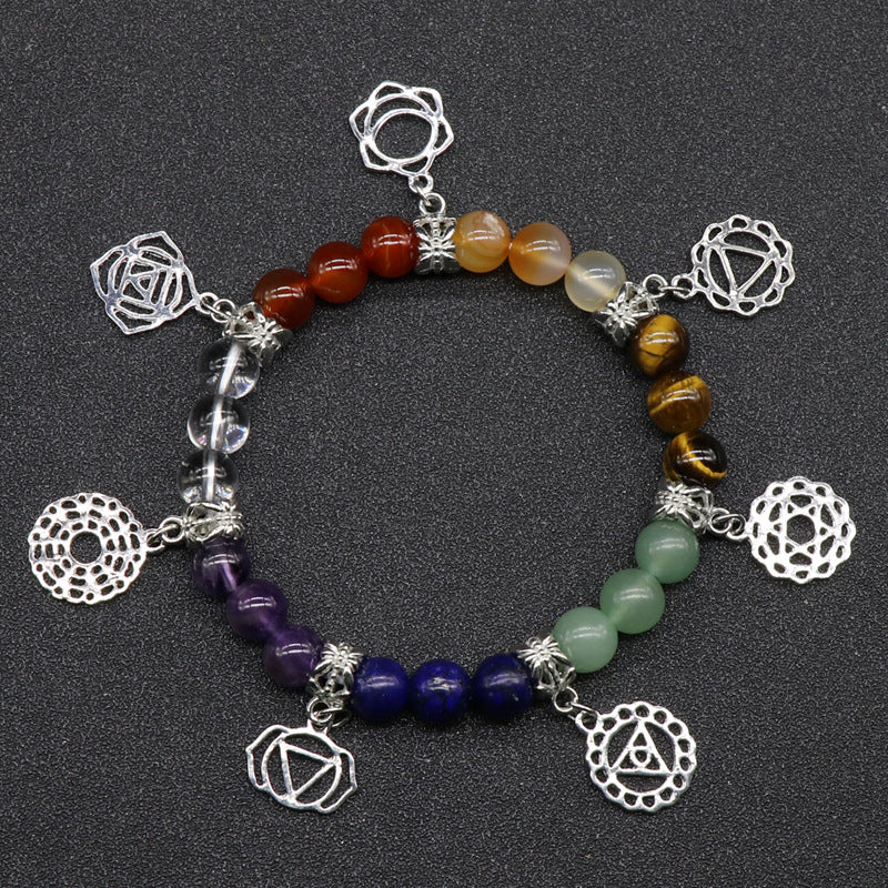 Natural Crystal 7 Chakra Bracelet. Designed to support balanced energy, inner peace, emotional healing, and spiritual growth, this chakra jewelry helps keep your mind, body, and spirit aligned. Created with love and positive energy — Divine Aura by Roop.