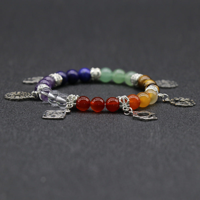 Natural Crystal 7 Chakra Bracelet. Designed to support balanced energy, inner peace, emotional healing, and spiritual growth, this chakra jewelry helps keep your mind, body, and spirit aligned. Created with love and positive energy — Divine Aura by Roop.